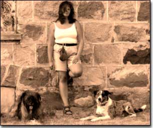 Briard-Artemis and Border Collie and Barbara leaning against Nicole homestead