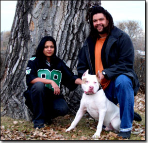 Wendy & Nate Davis with Malichai by a tree
